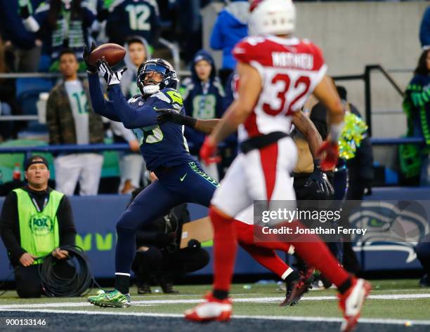 Wide receiver Doug Baldwin of the Seattle Seahawks brings in a 29 yard touchdown pass from Russell Wilson during the fourth quarter against the...