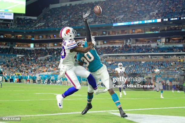 Cordrea Tankersley of the Miami Dolphins deflects the pass during the fourth quarter against the Buffalo Bills at Hard Rock Stadium on December 31,...