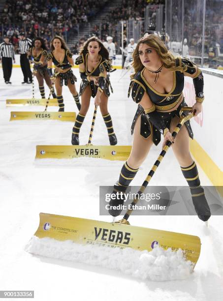 Members of the Knights Crew clean the ice during the Vegas Golden Knights' game against the Toronto Maple Leafs at T-Mobile Arena on December 31,...