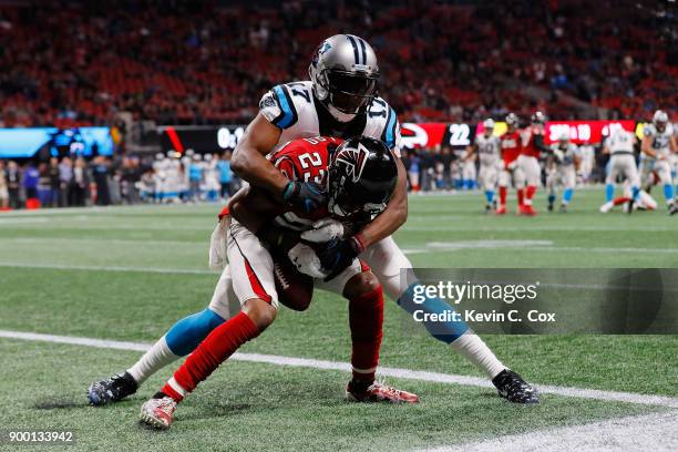 Robert Alford of the Atlanta Falcons intercepts a pass intended for Devin Funchess of the Carolina Panthers to end the game against the Carolina...