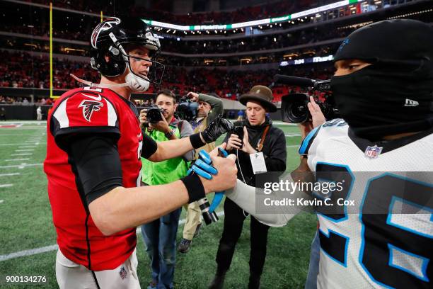 Matt Ryan of the Atlanta Falcons shakes hands with Daryl Worley of the Carolina Panthers after the game at Mercedes-Benz Stadium on December 31, 2017...