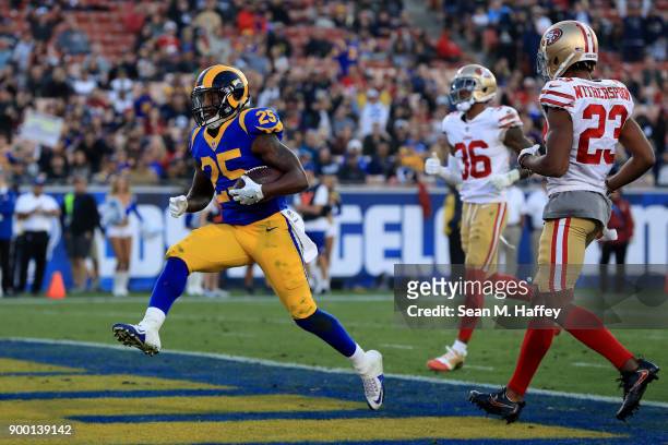 Lance Dunbar of the Los Angeles Rams runs in a touchdown past Ahkello Witherspoon and Dontae Johnson of the San Francisco 49ers during the second...