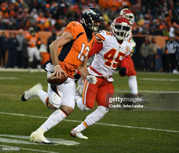 Kansas City Chiefs linebacker Ukeme Eligwe chases Denver Broncos quarterback Paxton Lynch as he runs towards the sidelines during the third quarter...