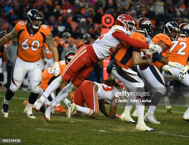 Denver Broncos quarterback Paxton Lynch gets sacked by Kansas City Chiefs linebacker Tanoh Kpassagnon during the third quarter on December 31, 2017...