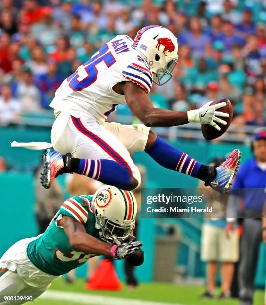 Buffalo Bills running back LeSean McCoy leaps over the Miami Dolphins' Cordrea Tankersley in the first quarter at the Hard Rock Stadium in Miami...