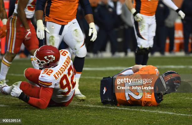 Denver Broncos quarterback Paxton Lynch gets sacked by Kansas City Chiefs linebacker Tanoh Kpassagnon during the third quarter on December 31, 2017...