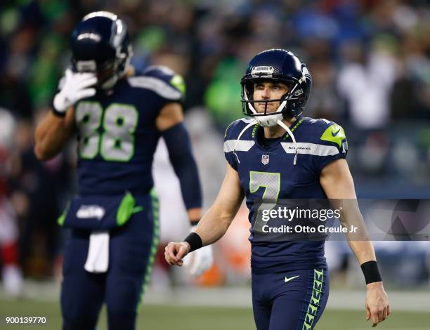 Kicker Blair Walsh of the Seattle Seahawks walks off the field after his field goal attempt to take the lead over the Arizona Cardinals is no good...