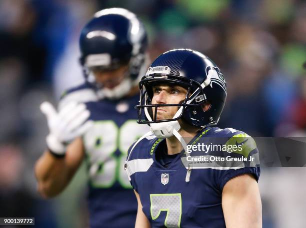 Kicker Blair Walsh of the Seattle Seahawks walks off the field after his field goal attempt to take the lead over the Arizona Cardinals is no good...