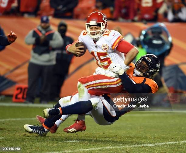 Denver Broncos defensive end DeMarcus Walker sacks Kansas City Chiefs quarterback Patrick Mahomes late in the fourth quarter on December 31, 2017 in...