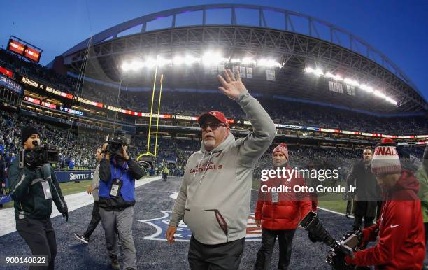 Head coach Bruce Arians of the Arizona Cardinals heads off the field after a 26-24 win over the Seattle Seahawks at CenturyLink Field on December 31,...