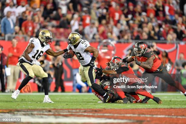 New Orleans Saints running back Mark Ingram II tries to break through the tackle by Tampa Bay Buccaneers linebacker Kwon Alexander and Tampa Bay...