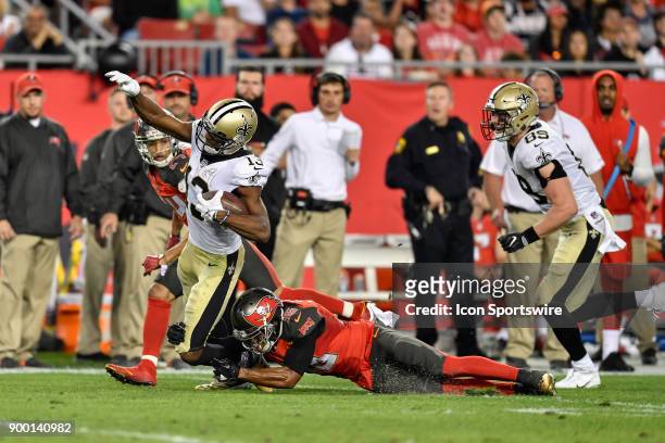 New Orleans Saints wide receiver Michael Thomas brought down by Tampa Bay Buccaneers cornerback Robert McClain during the second half of an NFL game...
