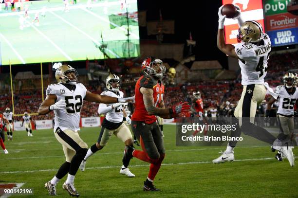 Free safety Marcus Williams of the New Orleans Saints intercepts a pass in the end zone intended for wide receiver Mike Evans of the Tampa Bay...