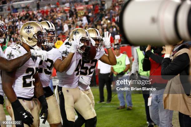 The New Orleans Saints pose for a team photo as they celebrate an interception in the end zone by free safety Marcus Williams of the New Orleans...