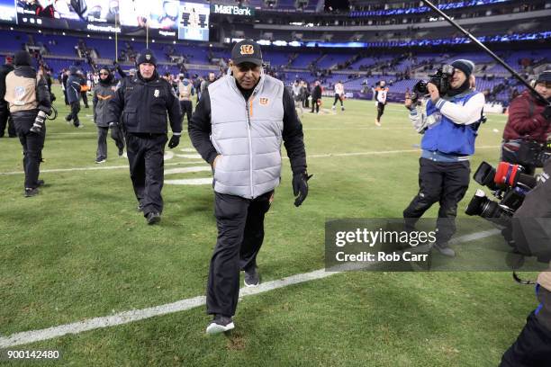 Head coach Marvin Lewis of the Cincinnati Bengals walks off the field after a 31-27 win over the Baltimore Ravens at M&T Bank Stadium on December 31,...