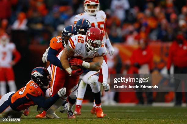 Fullback Anthony Sherman of the Kansas City Chiefs runs for a first down against inside linebacker Zaire Anderson and defensive back Will Parks of...