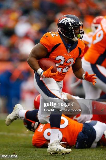 Running back C.J. Anderson of the Denver Broncos runs with the football during the first quarter against the Kansas City Chiefs at Sports Authority...