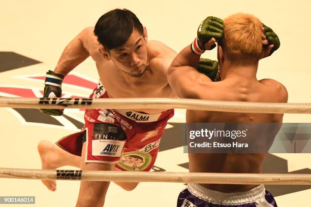 Shintaro Ishiwatari of Japan punches Takafumi Otsuka of Japan in the bantam weight GP semi-final bout during the RIZIN Fighting World Grand-Prix 2017...