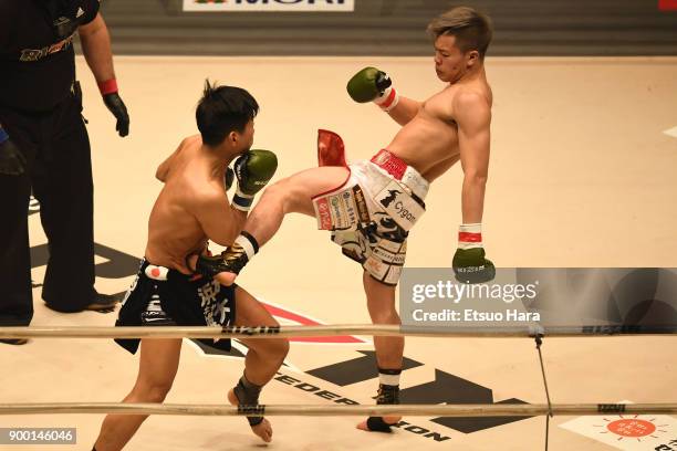 Tenshin Nasukawa of Japan kicks Yuta Cat Hamamoto of Japan in the kick boxing bout during the RIZIN Fighting World Grand-Prix 2017 final Round at...