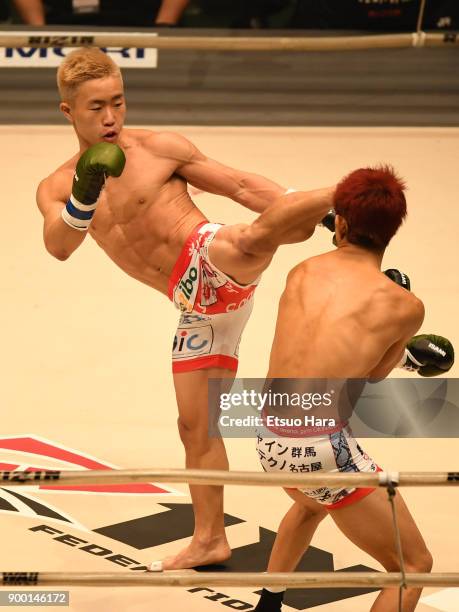 Yamato Fujita of Japan kicks Mitsuhisa Sunabe of Japan in the kick boxing bout during the RIZIN Fighting World Grand-Prix 2017 final Round at Saitama...