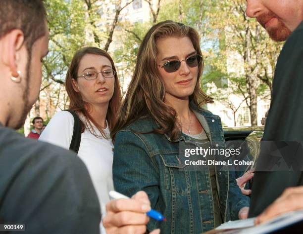 Actress Brooke Shields signs an autograph as she arrives for the "Kids for Kids" Carnival hosted by The Elizabeth Glaser Pediatric AIDS Foundation...