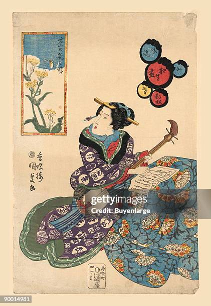 Song is written inspired by an art scroll adorning the room of this young musician. The Japanese woman here plays a three stringed banjo known in...
