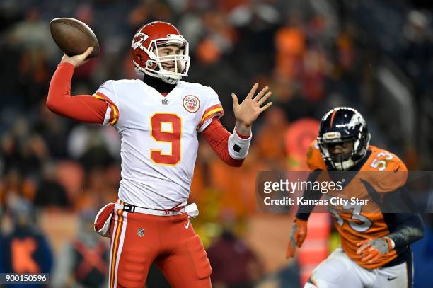 Kansas City Chiefs quarterback Tyler Bray throws an incompletion under pressure from Denver Broncos linebacker Deiontrez Mount on Sunday, Dec. 31 at...