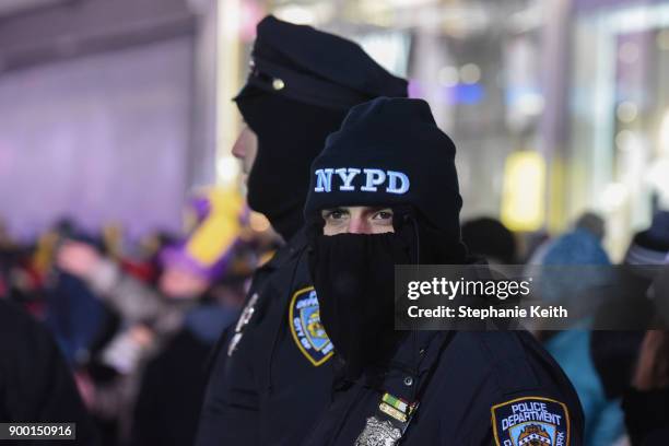 Members of the New York City police department patrol in Times Square ahead of the New Year's Eve celebration on December 31, 2017 in New York City.