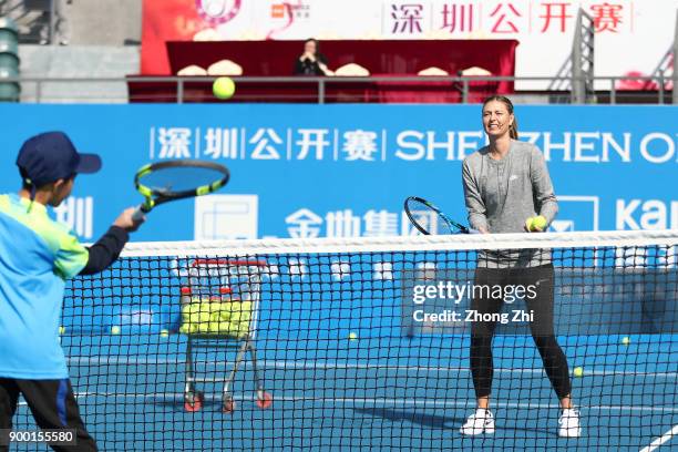 Maria Sharapova of Russia attends Kids Day during Day 1 of 2018 WTA Shenzhen Open at Longgang International Tennis Center on December 31, 2017 in...