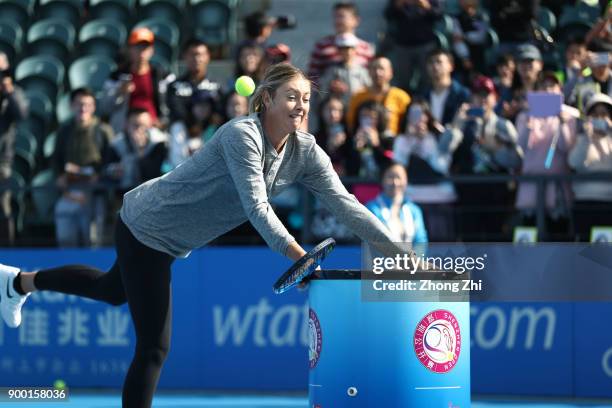 Maria Sharapova of Russia attends Kids Day during Day 1 of 2018 WTA Shenzhen Open at Longgang International Tennis Center on December 31, 2017 in...