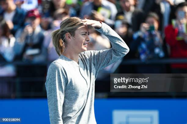 Maria Sharapova of Russia attends Kids Day during Day 1 of 2018 WTA Shenzhen Open at Longgang International Tennis Center on December 31, 2017 in...