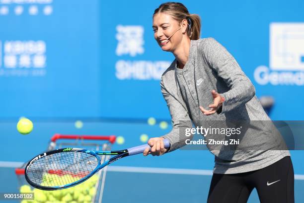 Maria Sharapova of Russia attends Kids Day during Day 1 of 2018 WTA Shenzhen Open at Longgang International Tennis Center on December 31, 2017 in...