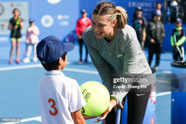 Maria Sharapova of Russia attends Kids Day during Day 1 of 2018 WTA Shenzhen Open at Longgang International Tennis Center on December 31, 2017 in...