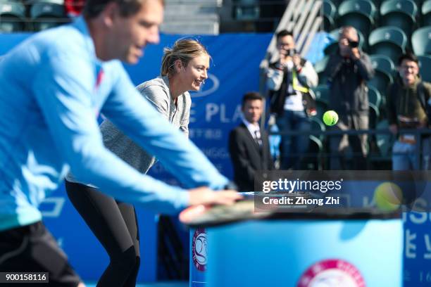 Maria Sharapova of Russia attends Kids Day during Day 1 of 2018 WTA Shenzhen Open at Longgang International Tennis Center on December 31, 2017 in...