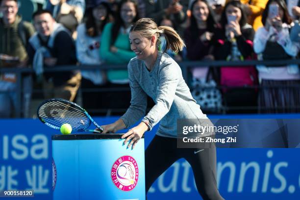 Maria Sharapova of Russia attends Kids Day during Day 1 of 2018 WTA Shenzhen Open at Longgang International Tennis Center on December 31, 2017 in...