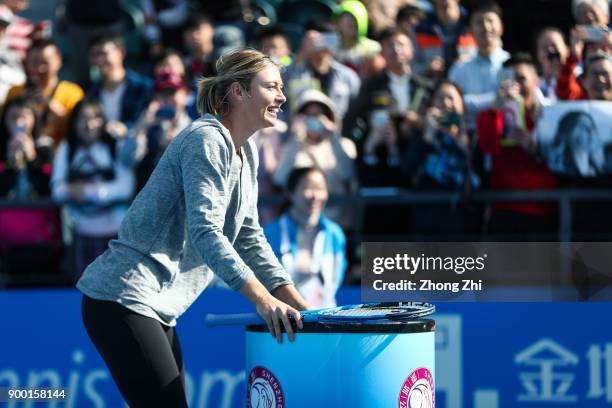 Maria Sharapova of Russia attends Kids Day during Day 1 of 2018 WTA Shenzhen Open at Longgang International Tennis Center on December 31, 2017 in...