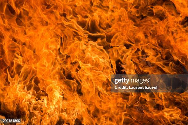 fire flames - laurent sauvel stock pictures, royalty-free photos & images