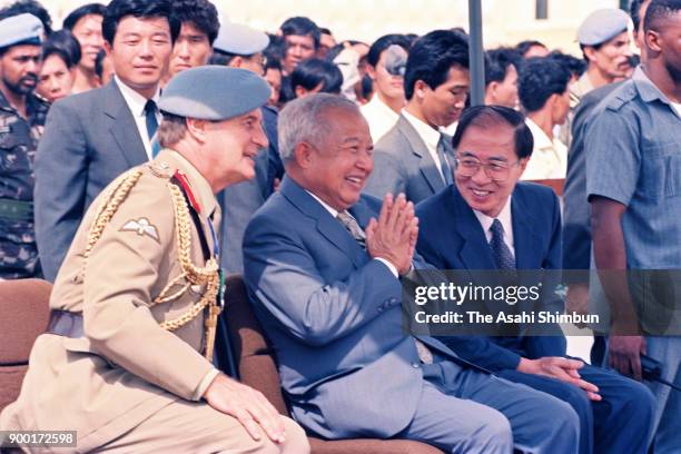 Prince Norodom Sihanouk of Cambodia and The United Nations Transitional Authority in Cambodia special representative Yasushi Akashi review the UNTAC...