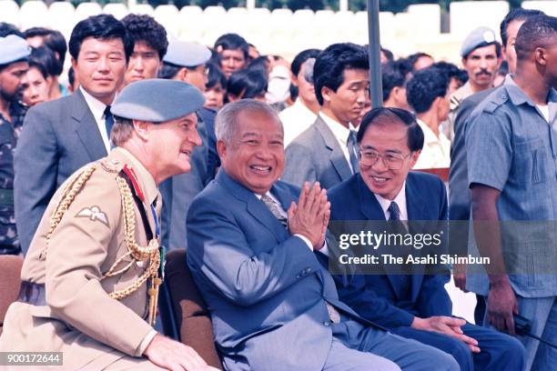 Prince Norodom Sihanouk of Cambodia and The United Nations Transitional Authority in Cambodia special representative Yasushi Akashi review the UNTAC...