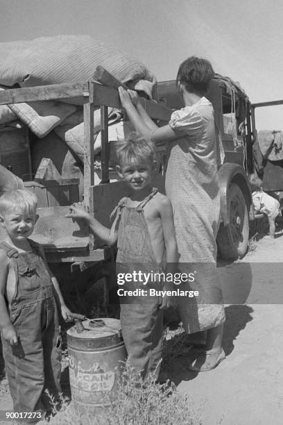 Part of an impoverished family of nine on a New Mexico highway. Depression refugees from Iowa. Left Iowa in 1932 because of father's ill health....