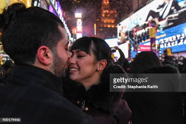 People kiss on New Year's Eve in Times Square on January 1, 2018 in New York City.