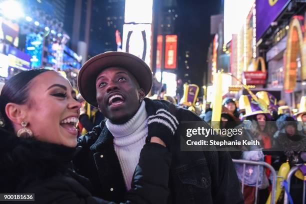 People celebrate on New Year's Eve in Times Square on December 31, 2017 in New York City.