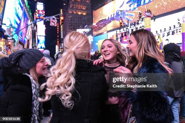 People celebrate on New Year's Eve in Times Square on December 31, 2017 in New York City.