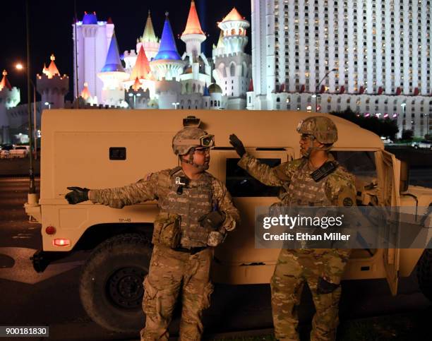 Nevada Army National Guard Sgt. Walter H. Lowell and Staff Sgt. L. Bundy talk on Tropicana Avenue near the Las Vegas Strip across from Excalibur...