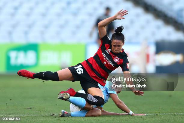 Alix Roberts of the Wanderers and Tyla Jay Vlajnic of Melbourne City compete for the ball during the round nine W-League match between the Western...