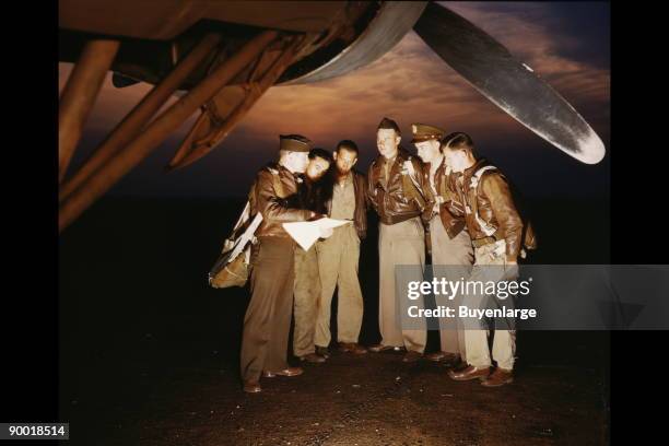 Combat crew receives final instructions just before taking off in a mighty YB-17 bomber from a bombardment squadron base at the field, Langley Field,...