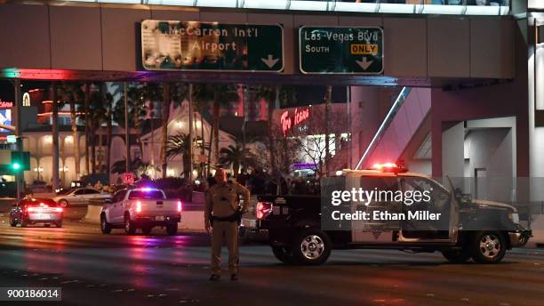 Las Vegas Metropolitan Police Department officers close Tropicana Avenue near the Las Vegas Strip on December 31, 2017 in Las Vegas, Nevada. An...