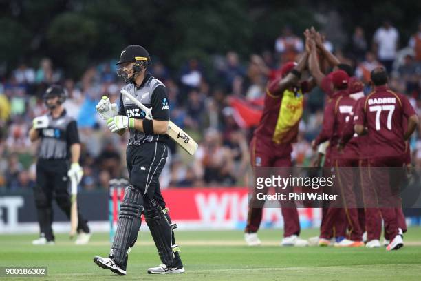 Martin Guptill of New Zealand leaves the field after being dismissed by Sheldon Cottrell of the West Indies during game two of the Twenty20 Series...