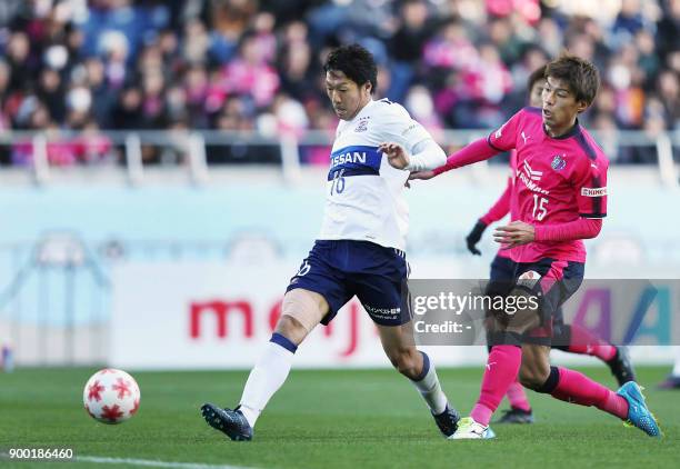 Yokohama F Marinos forward Sho Ito scores a goal past Cerezo Osaka midfielder Yasuki Kimoto during the Emperor's Cup football final between Cerezo...