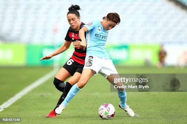 Yukari Kinga of Melbourne City and Alix Roberts of the Wanderers compete for the ball during the round nine W-League match between the Western Sydney...